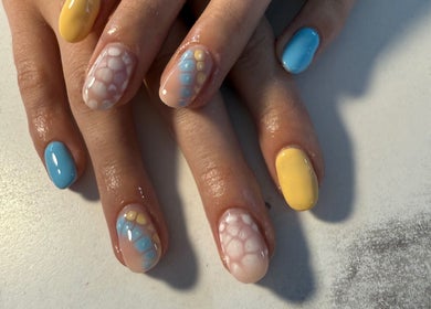Vibrant nail art design at Nails By Emm, Duncan, South Carolina, US showcasing colorful and creative patterns.