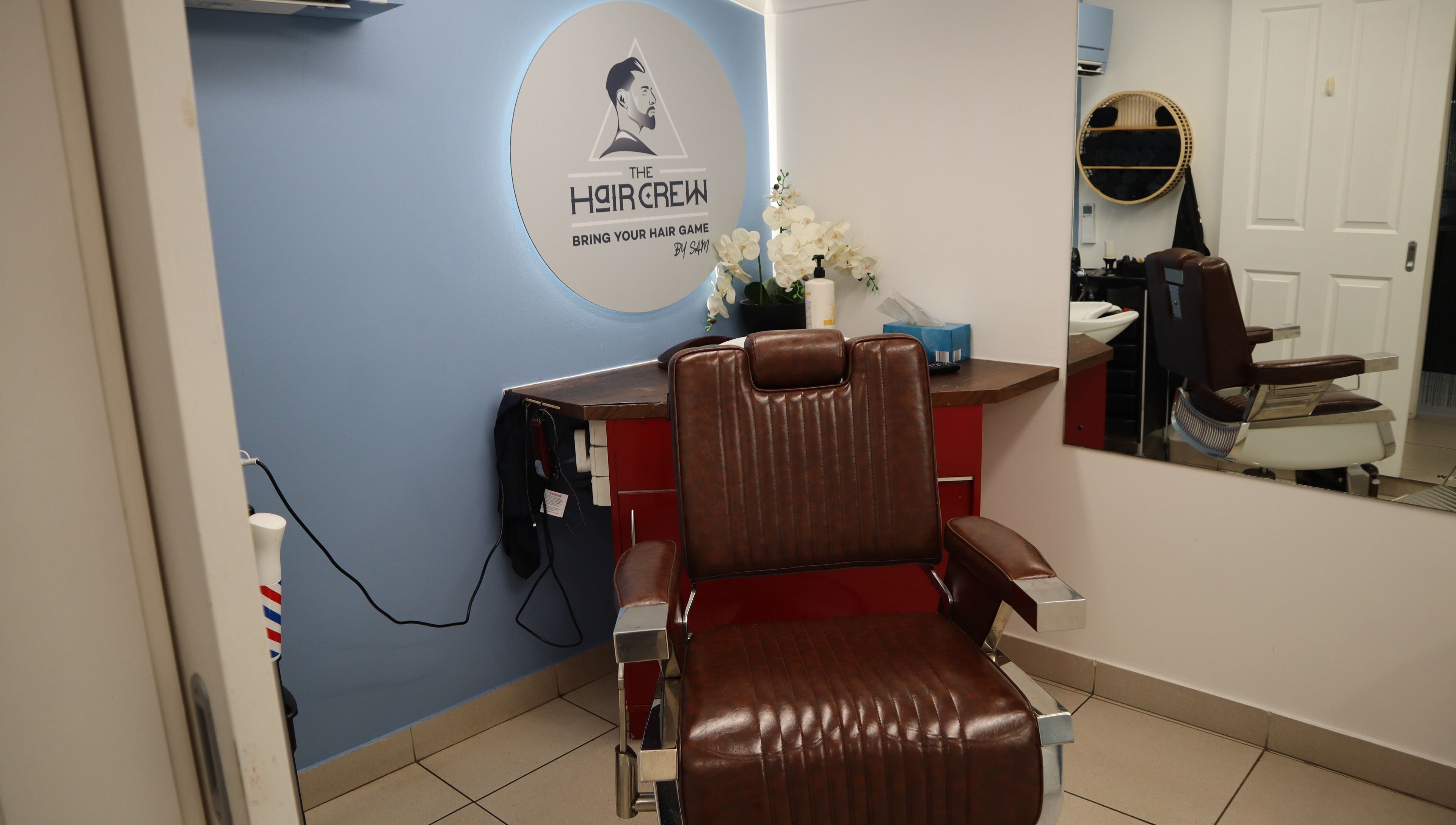 Comfortable barber chair at The Hair Crew Sydney in Yagoona, New South Wales, AU, enhancing any grooming experience.