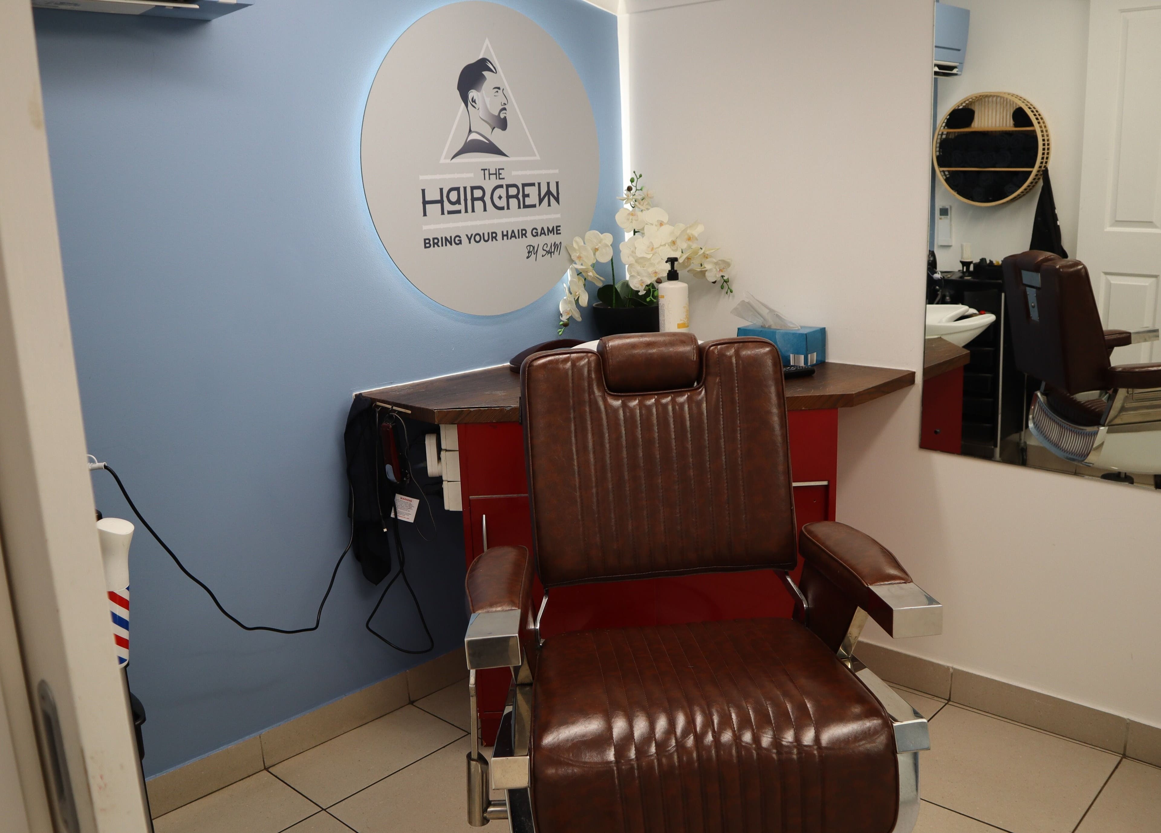 Comfortable barber chair at The Hair Crew Sydney in Yagoona, New South Wales, AU, enhancing any grooming experience.
