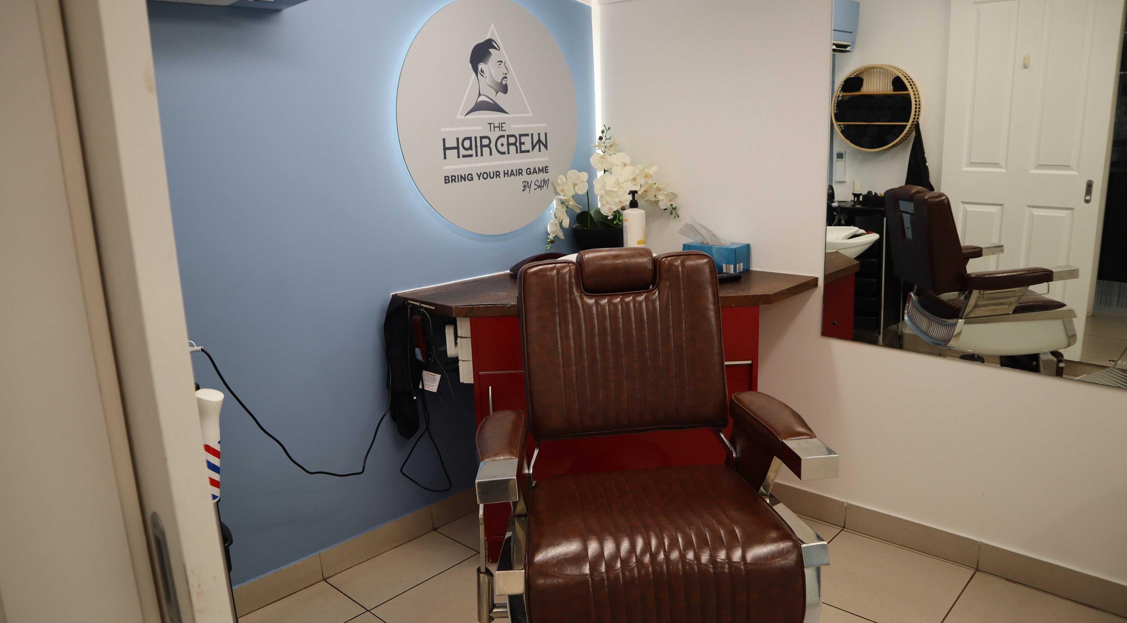 Comfortable barber chair at The Hair Crew Sydney in Yagoona, New South Wales, AU, enhancing any grooming experience.
