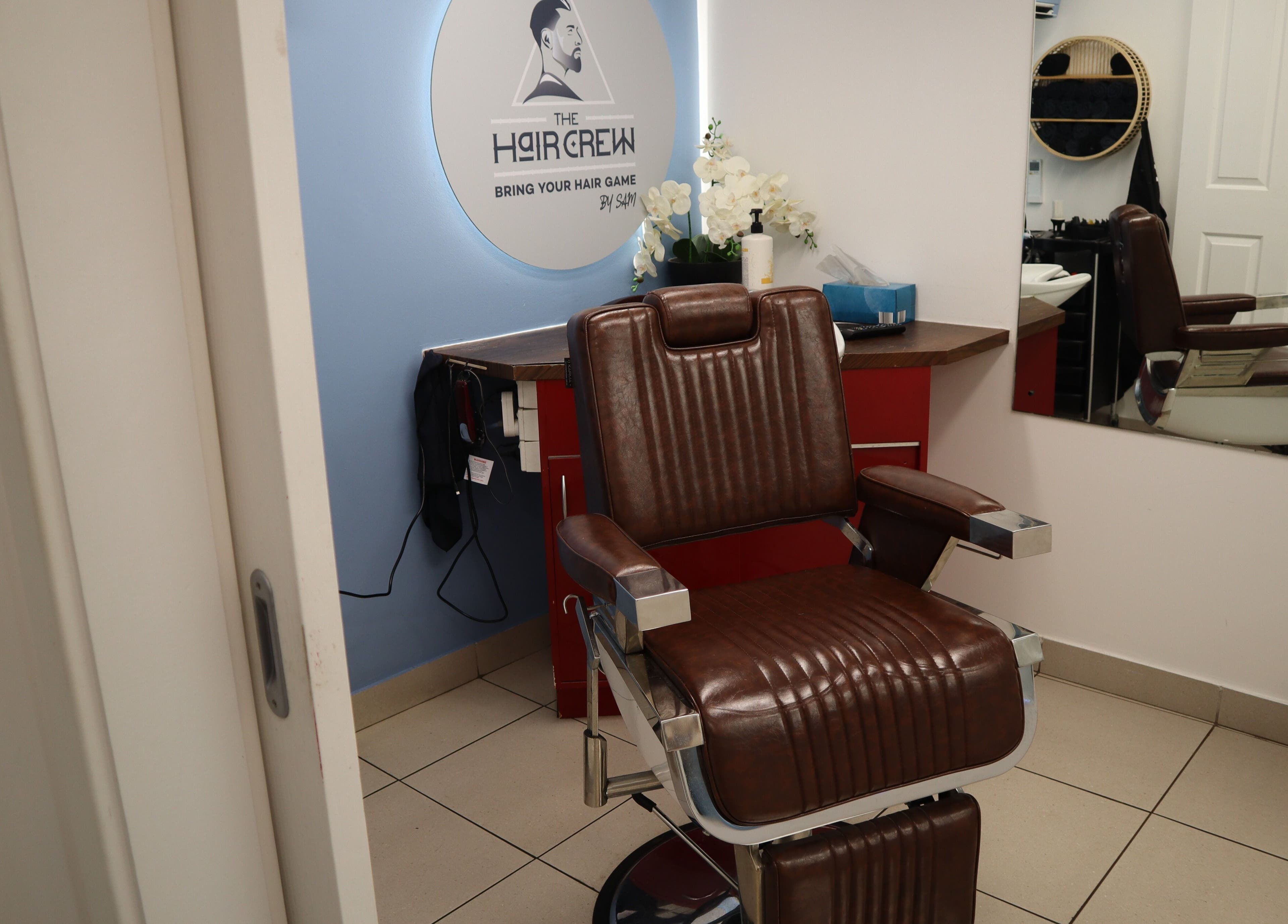 Modern barber chair at The Hair Crew Sydney in Yagoona, New South Wales, AU, offering premium grooming services.