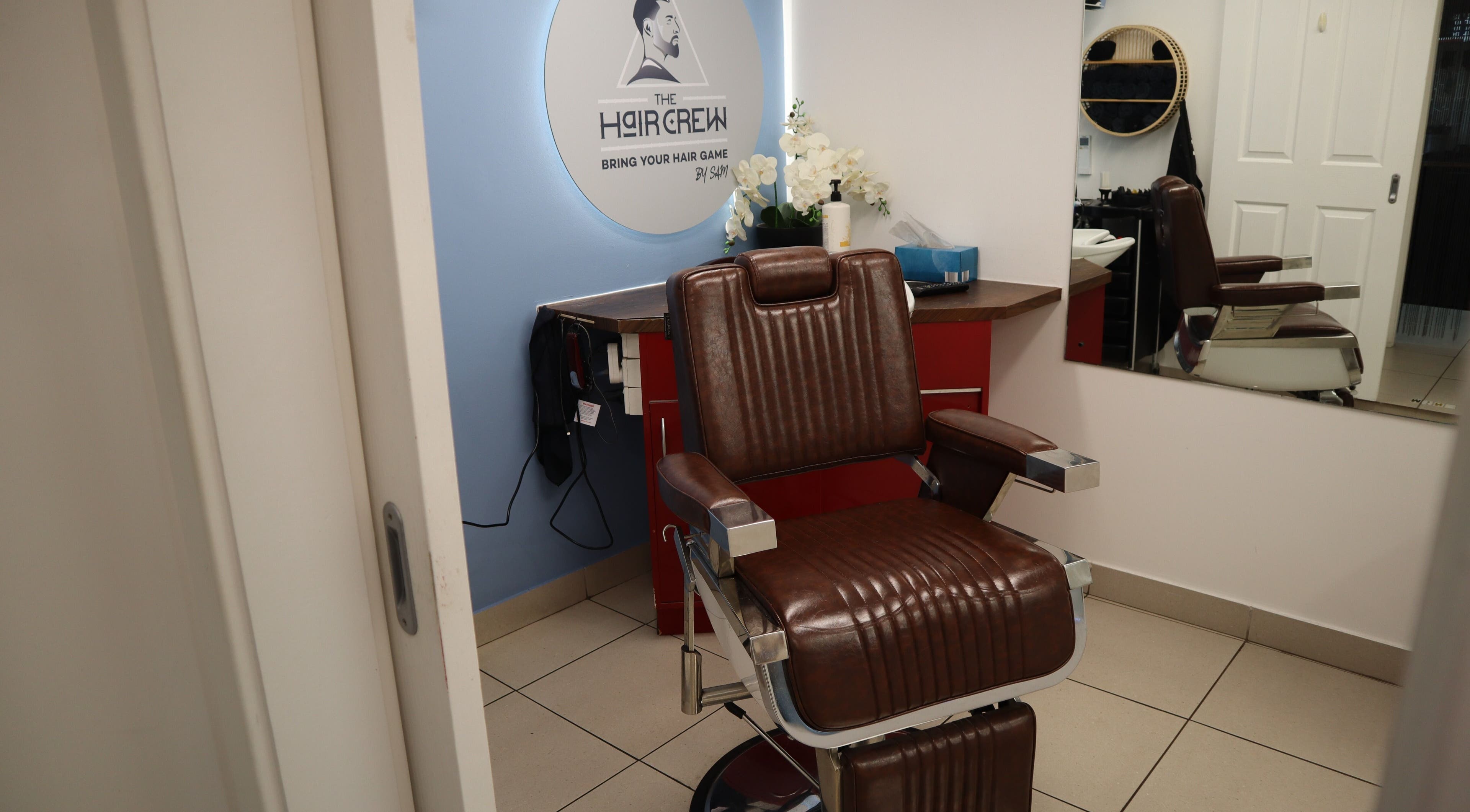 Modern barber chair at The Hair Crew Sydney in Yagoona, New South Wales, AU, offering premium grooming services.