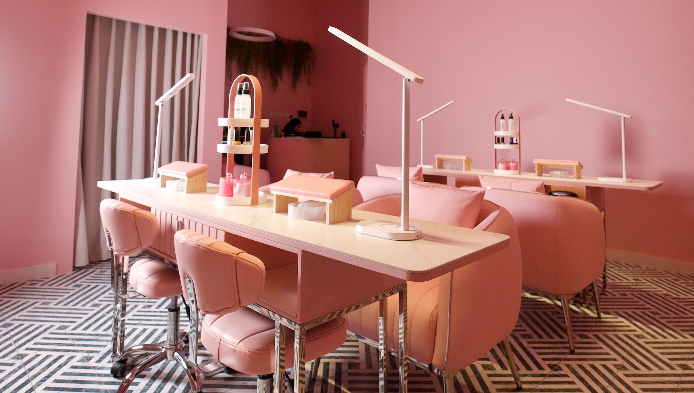 Chic pink interior of Nabaty Salon | صالون نباتي in Saihat, Eastern Province, SA featuring sleek nail stations.