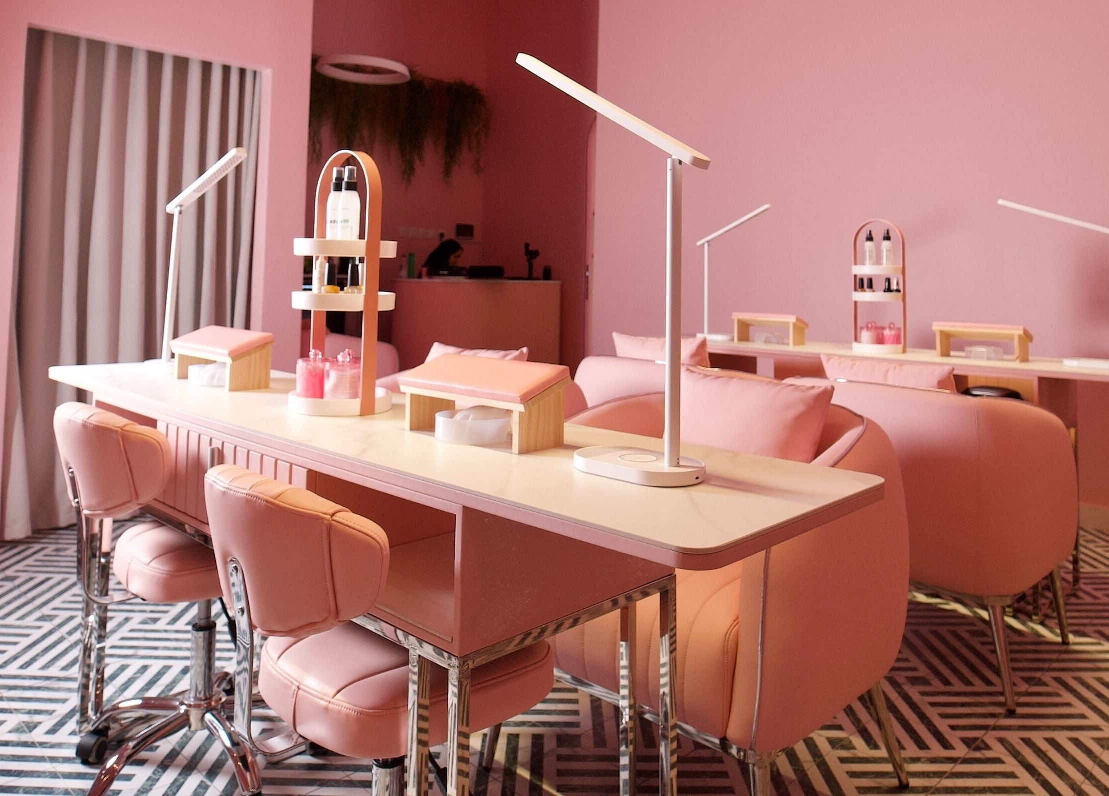 Chic pink interior of Nabaty Salon | صالون نباتي in Saihat, Eastern Province, SA featuring sleek nail stations.