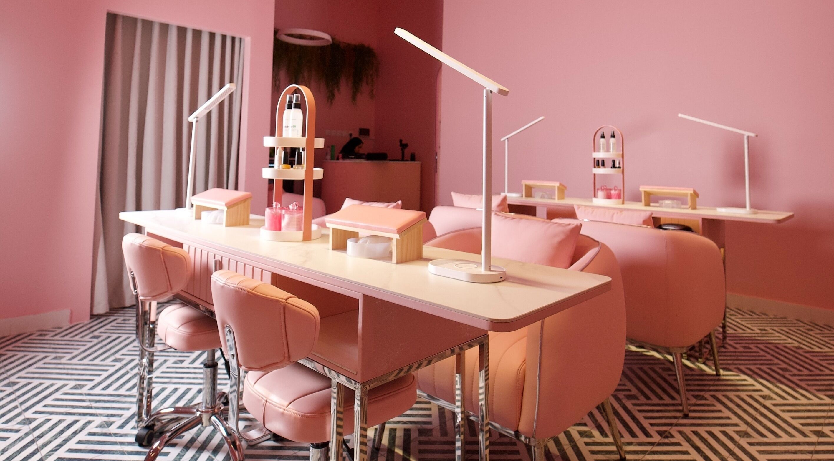 Chic pink interior of Nabaty Salon | صالون نباتي in Saihat, Eastern Province, SA featuring sleek nail stations.