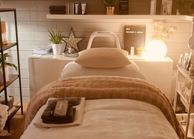 Relaxing spa treatment room at Refresh Skin and Body, Salisbury, England, GB, with serene decor and soft lighting.