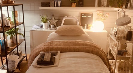 Relaxing spa treatment room at Refresh Skin and Body, Salisbury, England, GB, with serene decor and soft lighting.