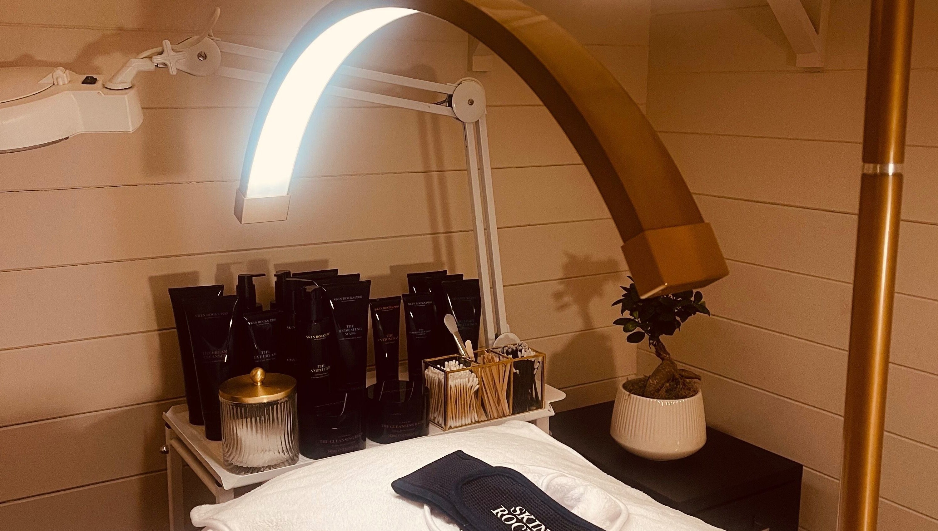 Luxury skincare setup at Refresh Skin and Body in Salisbury, England, GB. Elegant products and lighting.