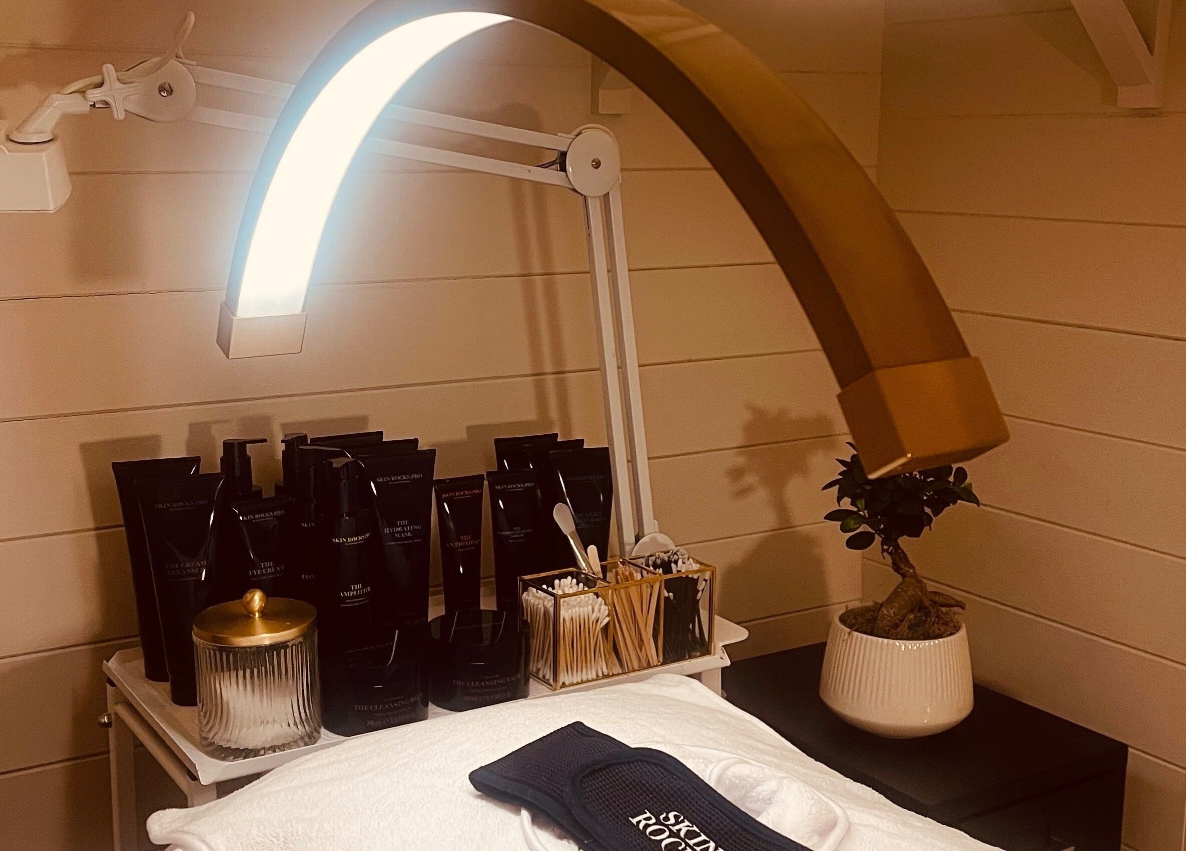 Luxury skincare setup at Refresh Skin and Body in Salisbury, England, GB. Elegant products and lighting.