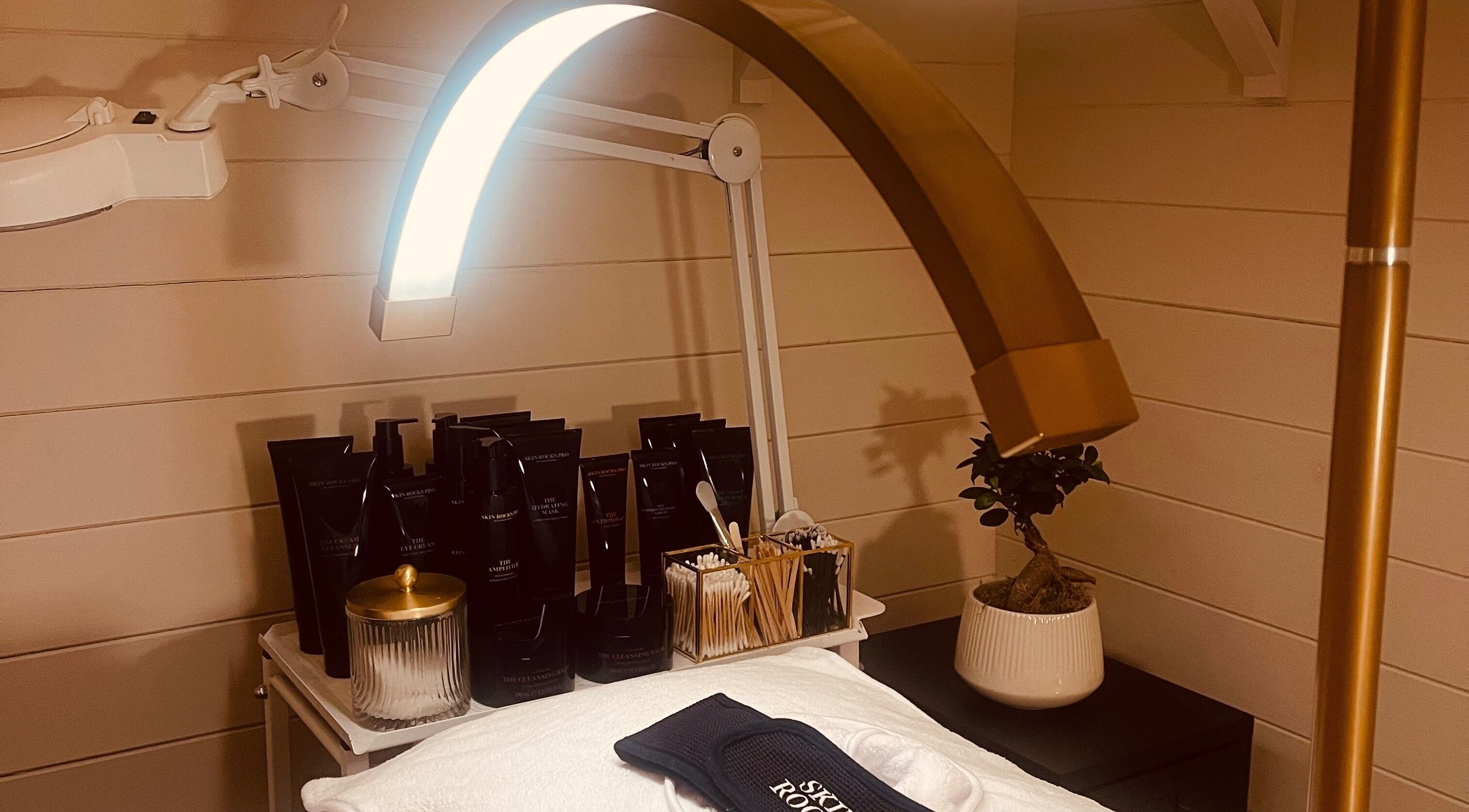 Luxury skincare setup at Refresh Skin and Body in Salisbury, England, GB. Elegant products and lighting.