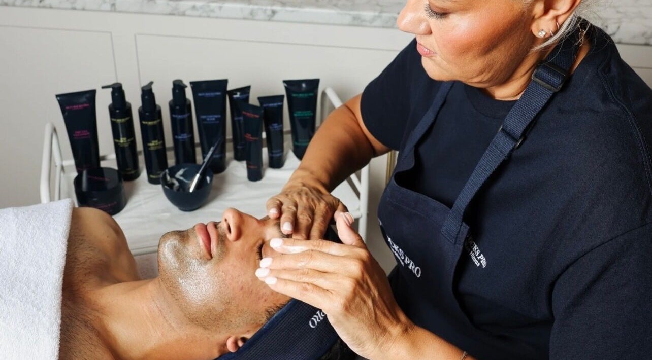Guest receiving a relaxing facial at Refresh Skin and Body, Salisbury, England, GB with skincare products.