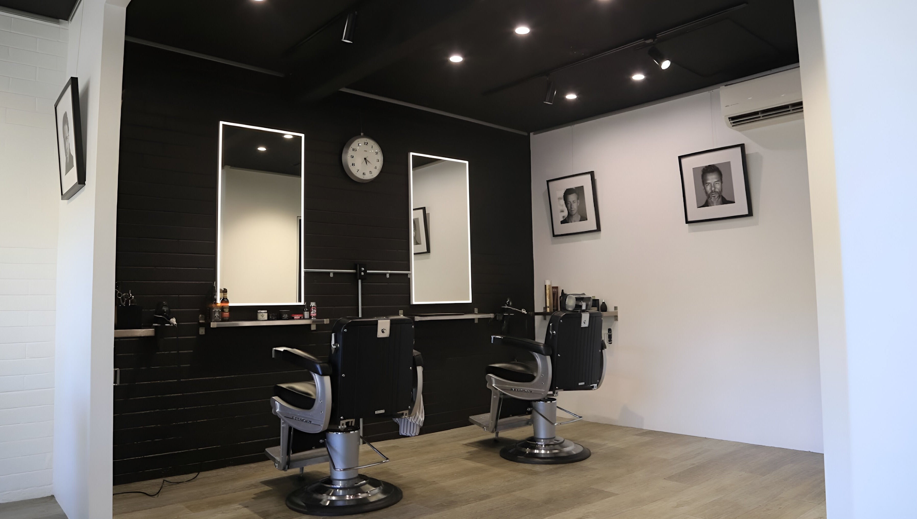 Elegant interior of JK Barber Room in Kenmore, Queensland, AU, showcasing modern barber chairs and stylish decor.