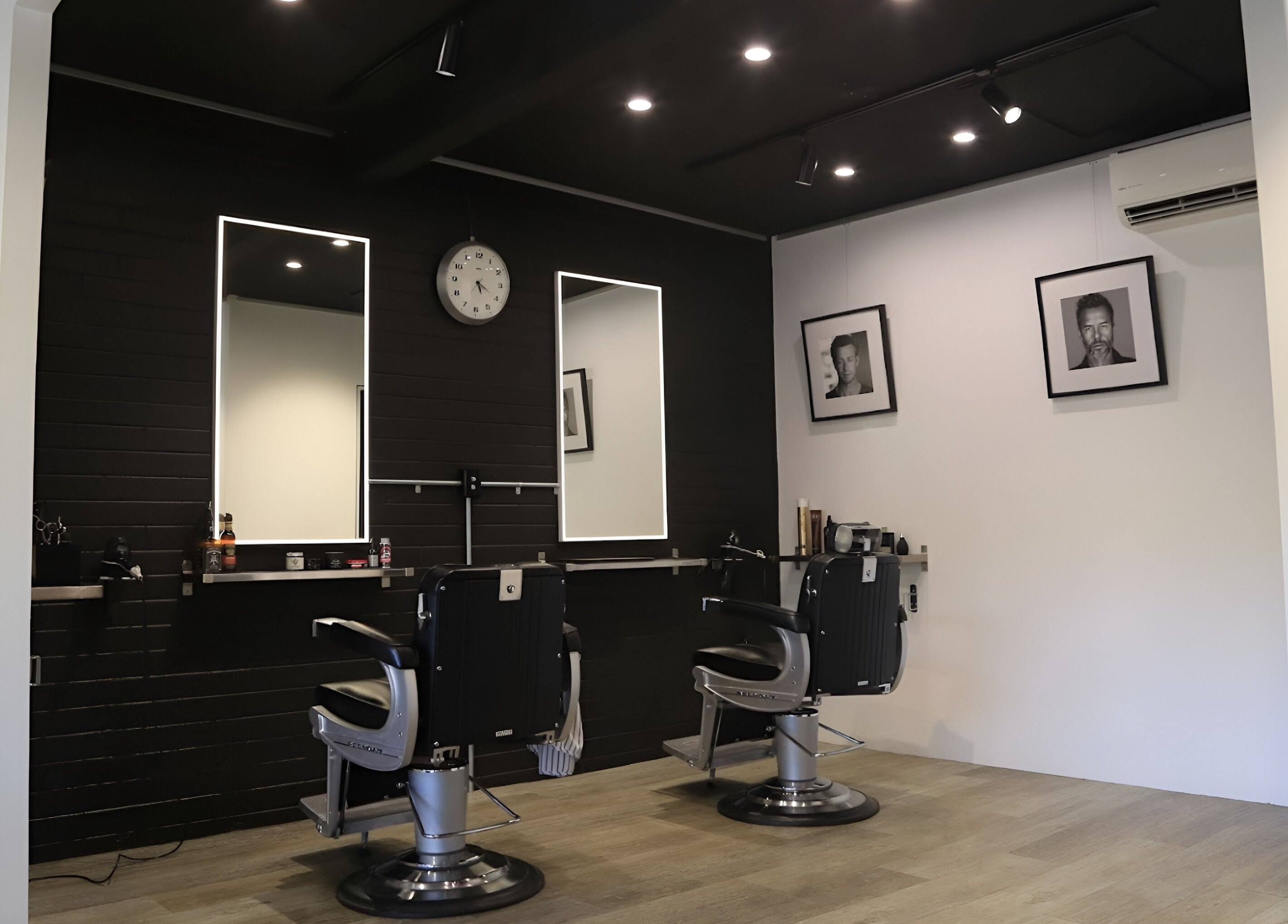 Elegant interior of JK Barber Room in Kenmore, Queensland, AU, showcasing modern barber chairs and stylish decor.