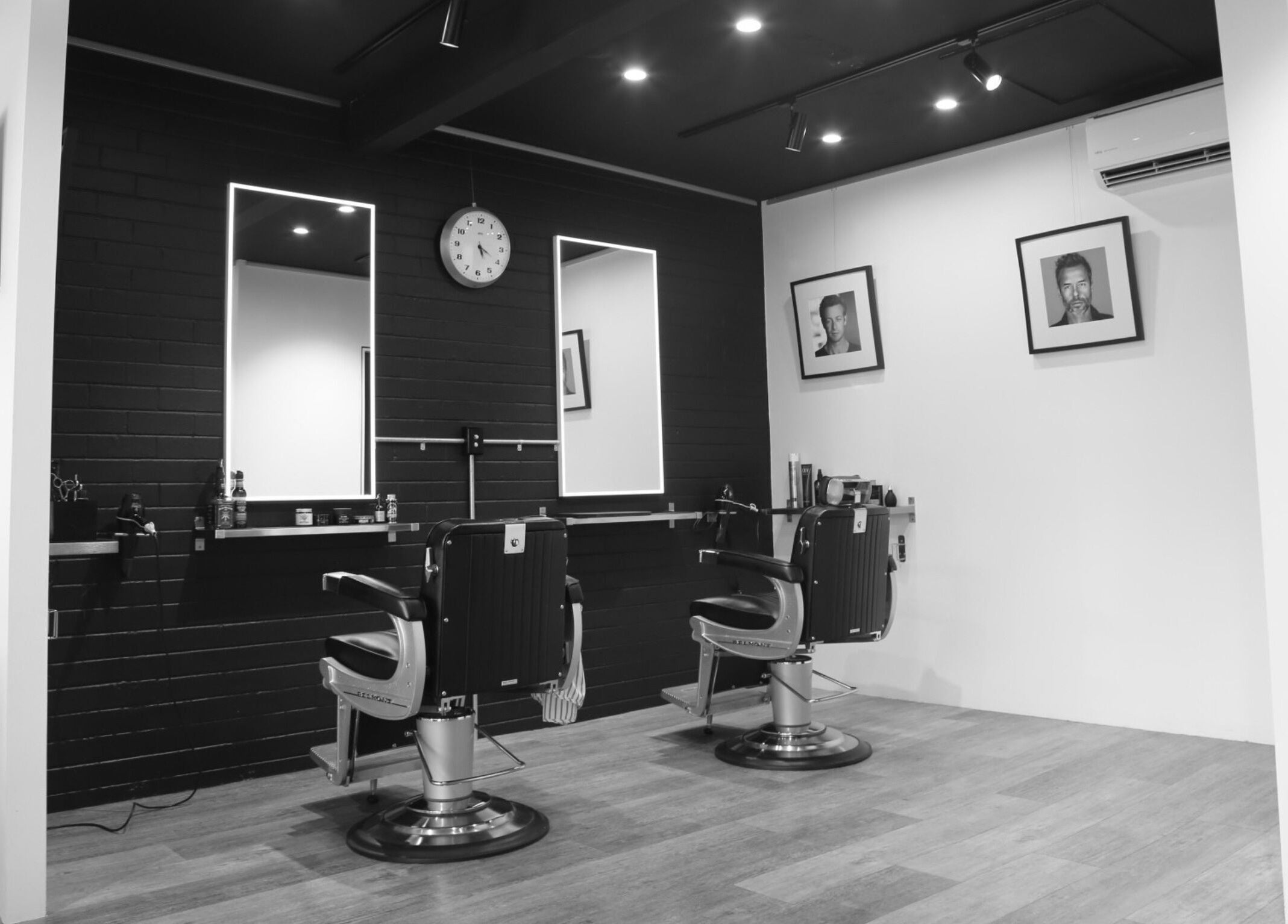 Sleek and modern barber chairs in JK Barber Room, Kenmore, Queensland, AU. Stylish and professional setting.