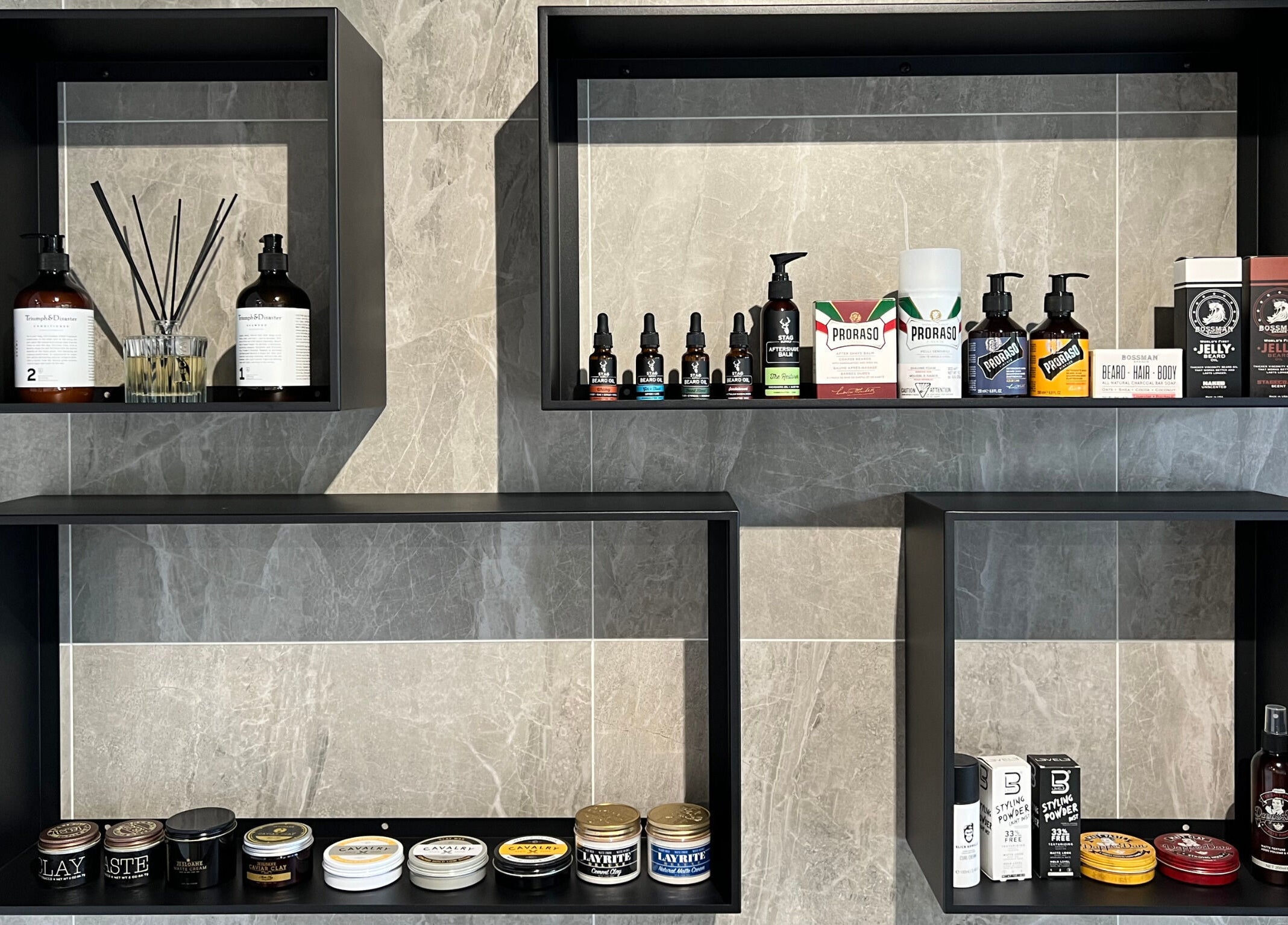 Grooming products on sleek shelves at JK Barber Room, Kenmore, Queensland, AU.