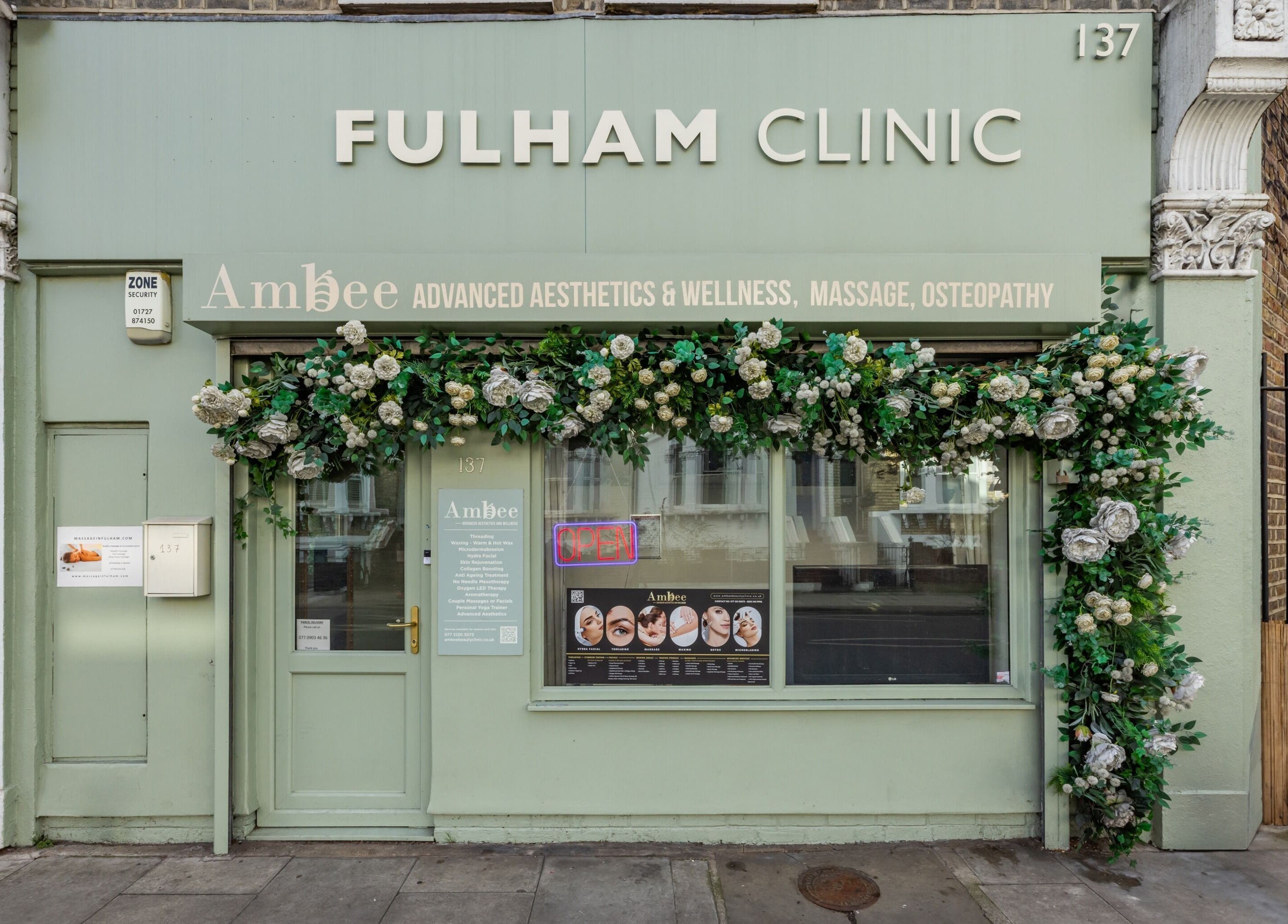 Front view of Fulham - Ambee Advanced Aesthetics & Wellness in London, England, GB with floral decoration.