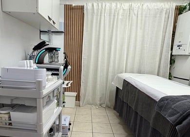Treatment room at Cosmic Beauty & Wellness (Mia Elegance Nails), London, England, GB. Professional spa equipment visible.