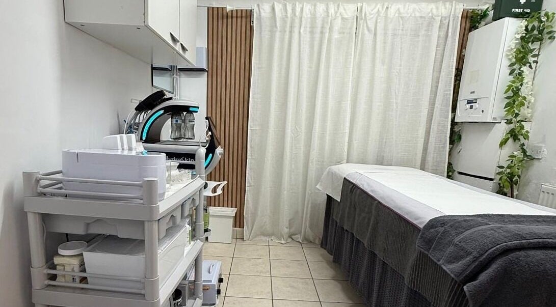Treatment room at Cosmic Beauty & Wellness (Mia Elegance Nails), London, England, GB. Professional spa equipment visible.