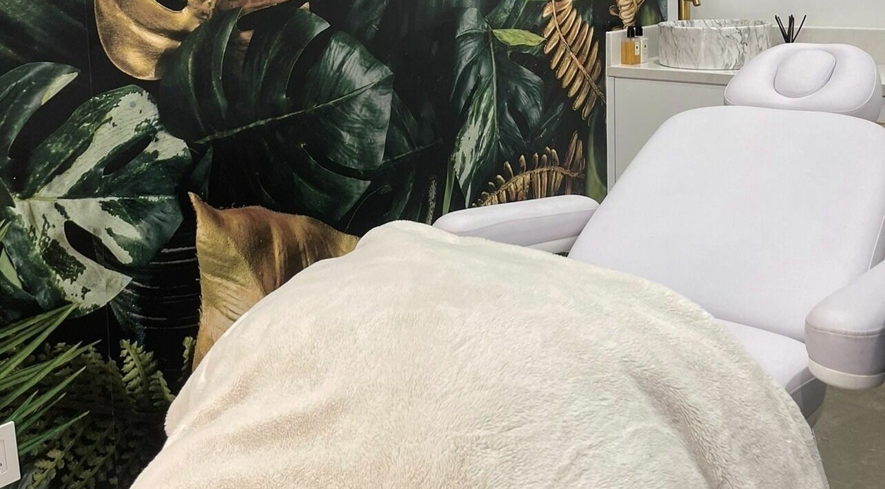 Luxurious treatment room at Bodyful Aesthetics + Academy in Toronto, Ontario, CA, featuring a plush massage bed.