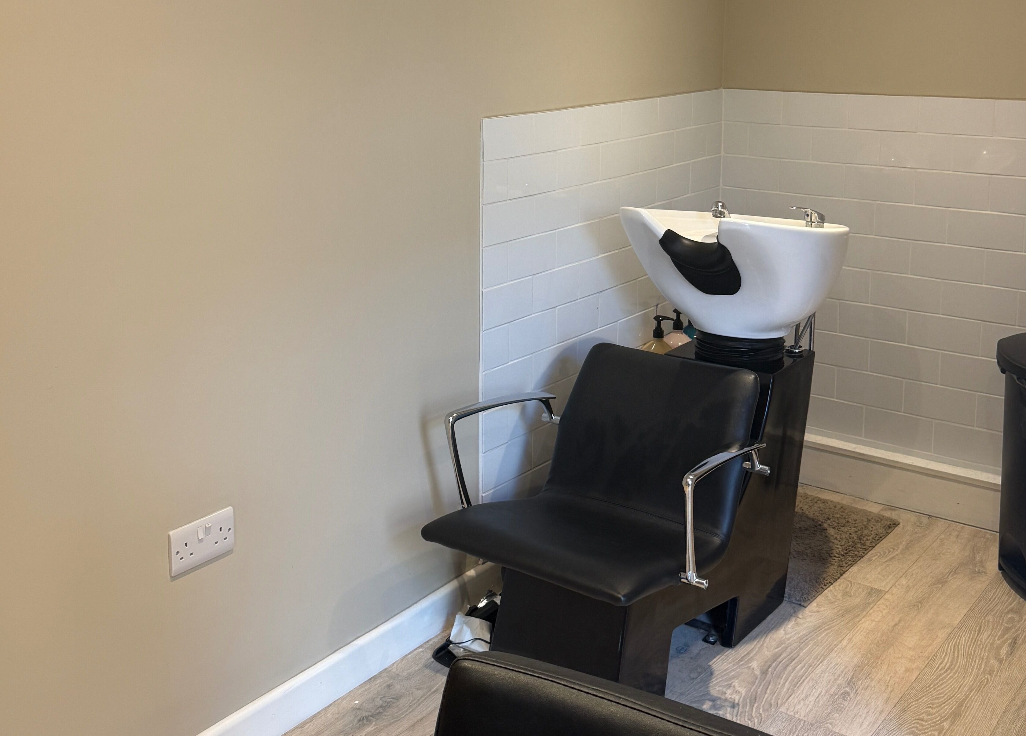 Hair wash station at The Olive Room, Newbury, England, GB, featuring sleek design and modern comforts.
