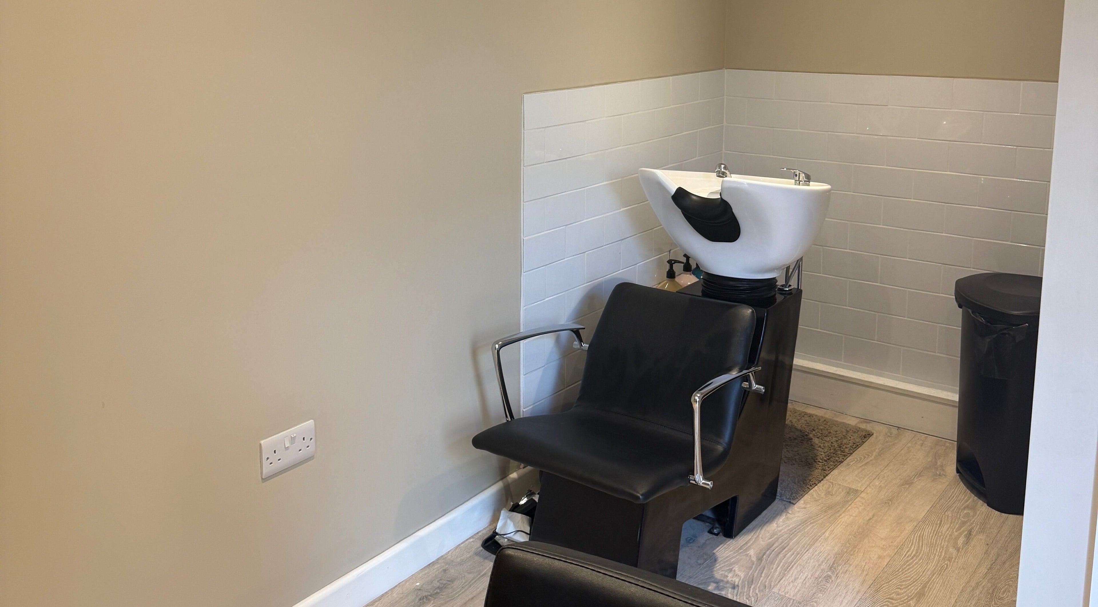 Hair wash station at The Olive Room, Newbury, England, GB, featuring sleek design and modern comforts.