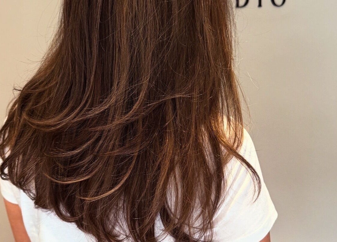 Sleek, layered hairstyle showcased at The Olive Room, Newbury, England, GB.