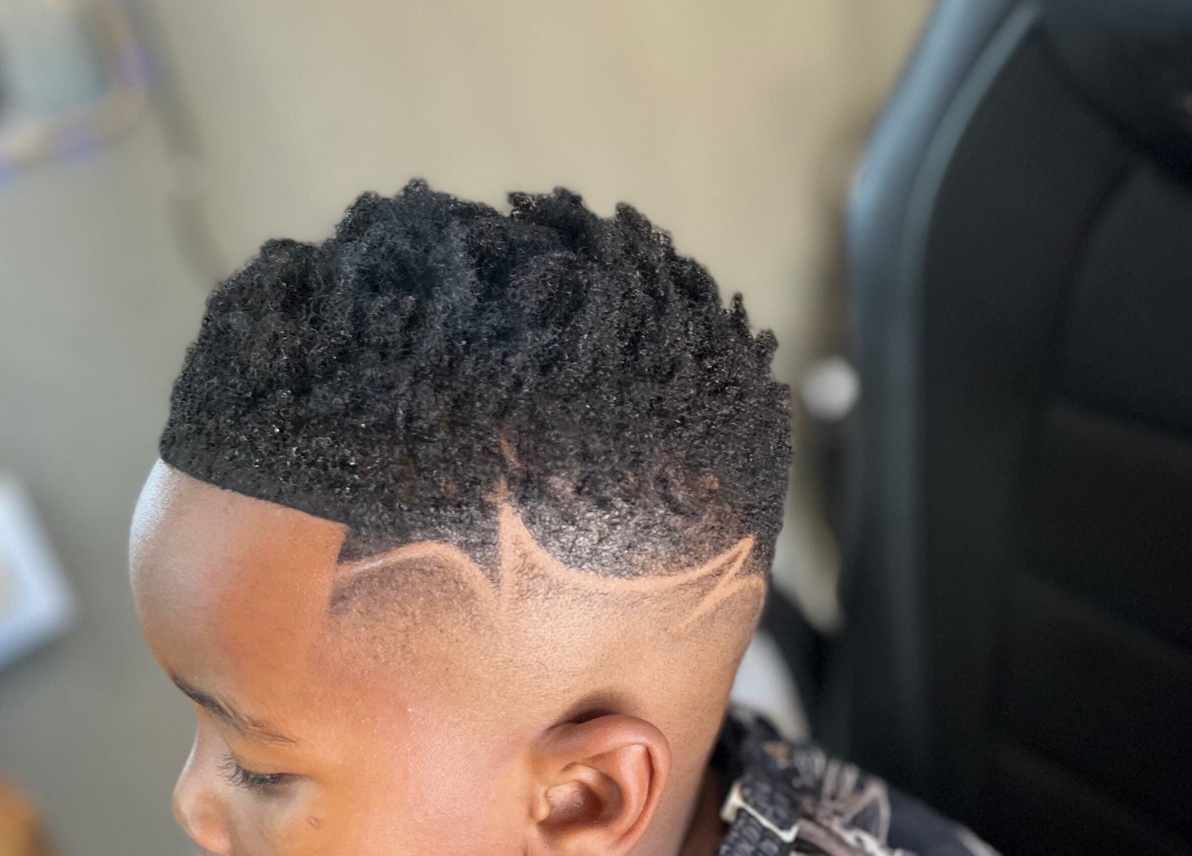 Stylish fade haircut with patterns at Treys Studio, Clau-clau, Mpumalanga, ZA.