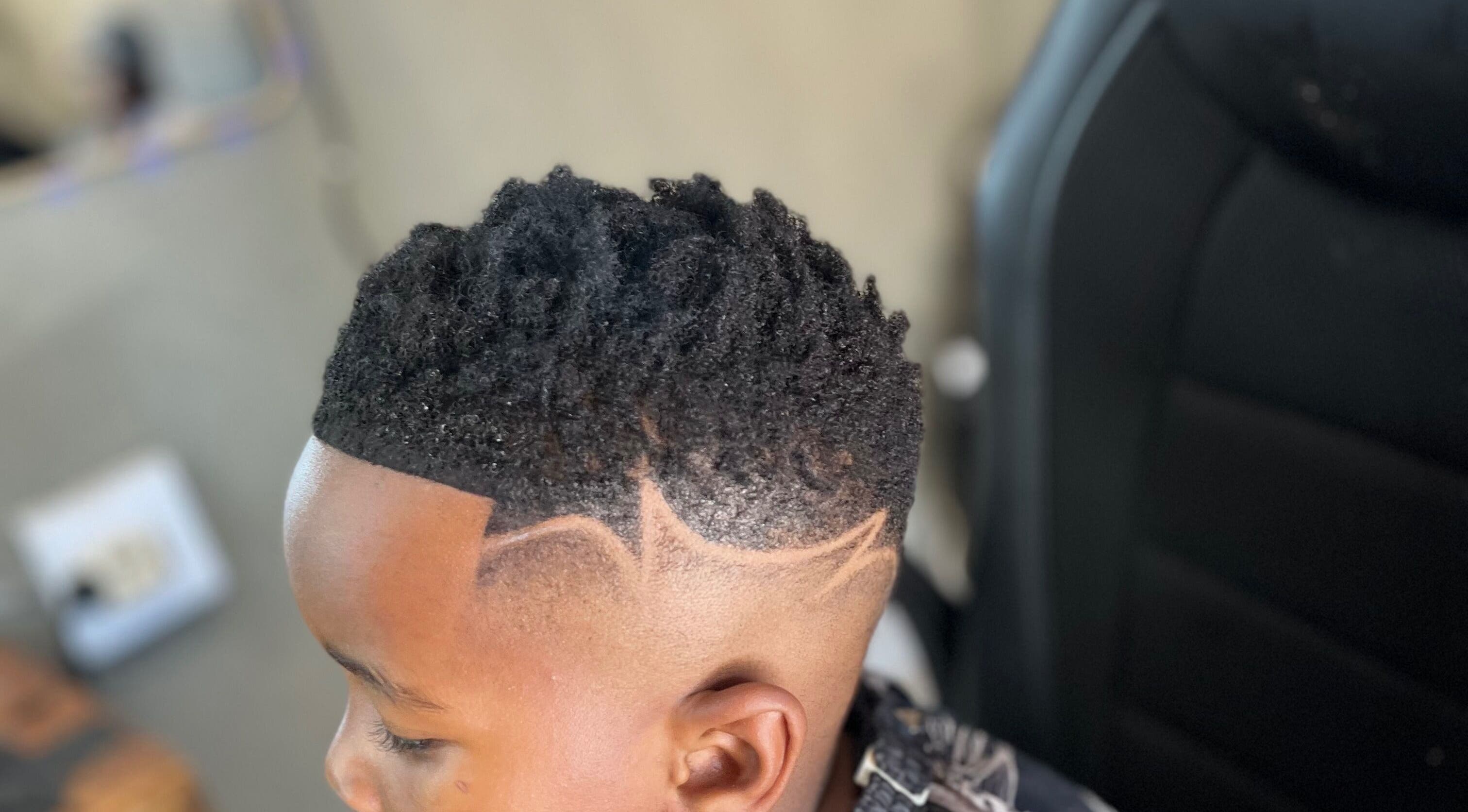 Stylish fade haircut with patterns at Treys Studio, Clau-clau, Mpumalanga, ZA.