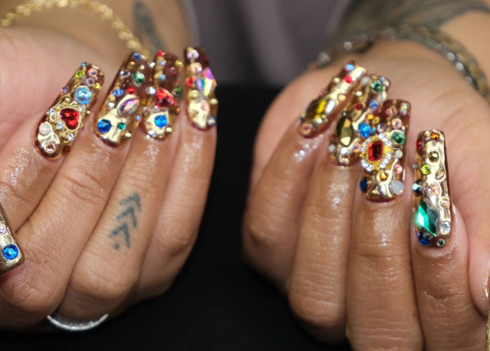 Exquisite gemstone nail art by Naild By Tee in Chicago Heights, Illinois, US, showcasing colorful gems.