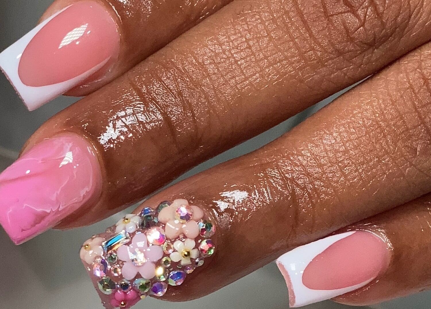 Intricate pink and jeweled nail art at Naild By Tee in Chicago Heights, Illinois, US.
