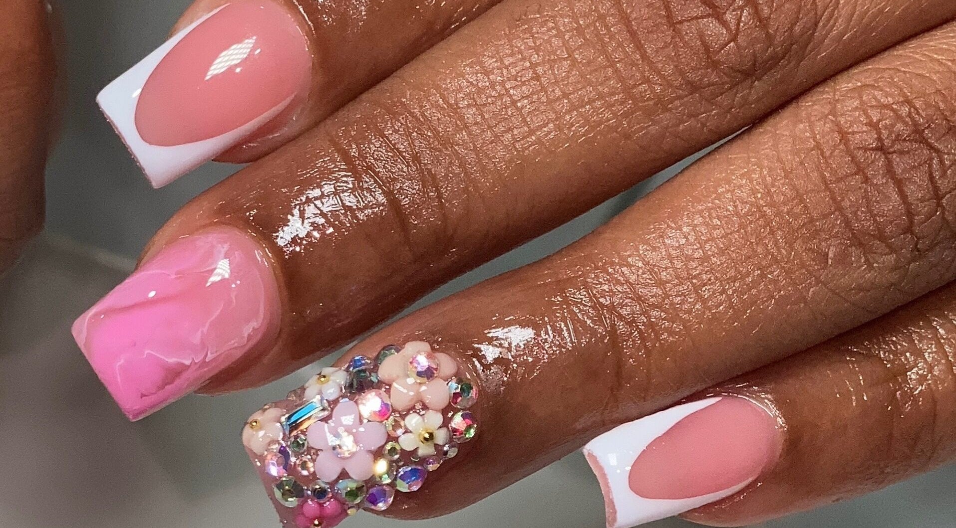 Intricate pink and jeweled nail art at Naild By Tee in Chicago Heights, Illinois, US.