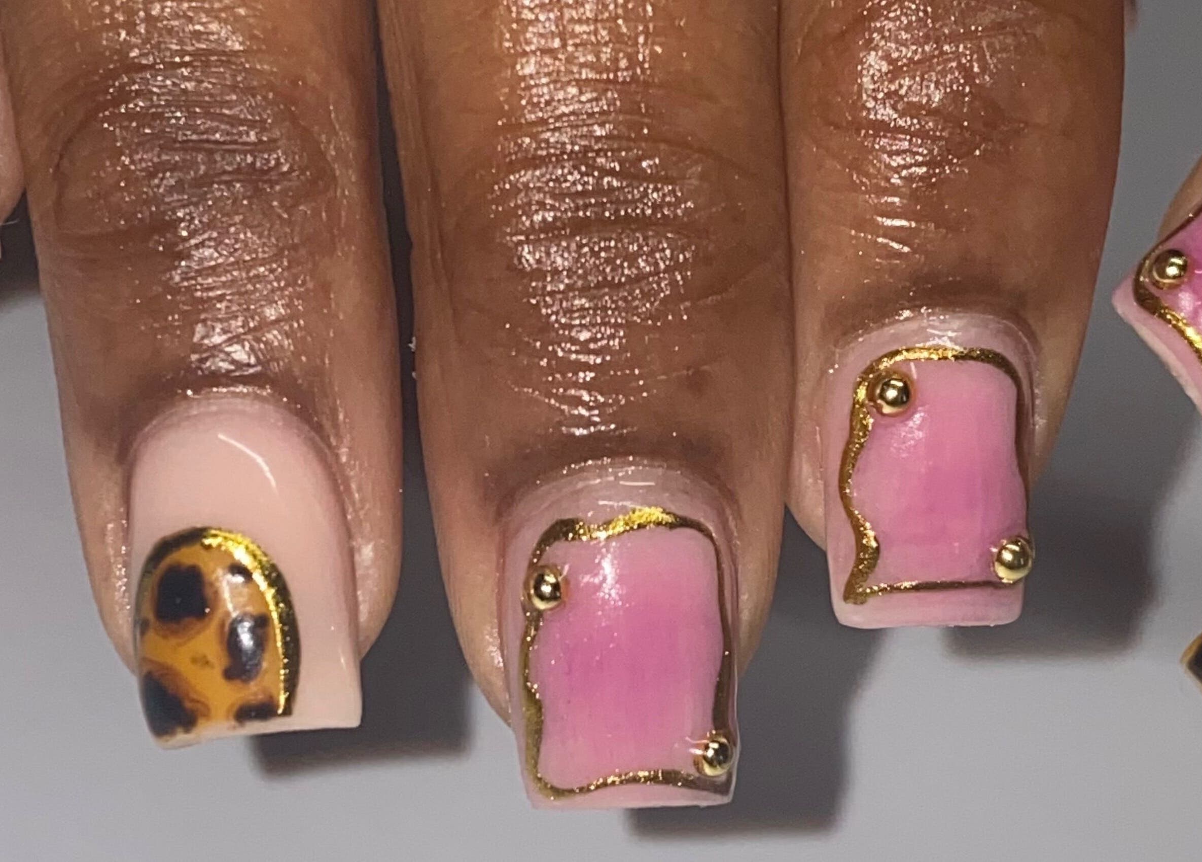 Elegant nail art with pink and leopard designs at Naild By Tee in Chicago Heights, Illinois, US.