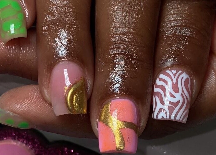 Vibrant nail art with green, gold, and white designs at Naild By Tee, Chicago Heights, Illinois, US.
