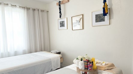 Tranquil massage room at Thai House Wellness and Spa in Sacramento, California, US with calming decor.