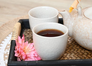 Tea set with pink flower at Thai House Wellness and Spa in Sacramento, California, US.