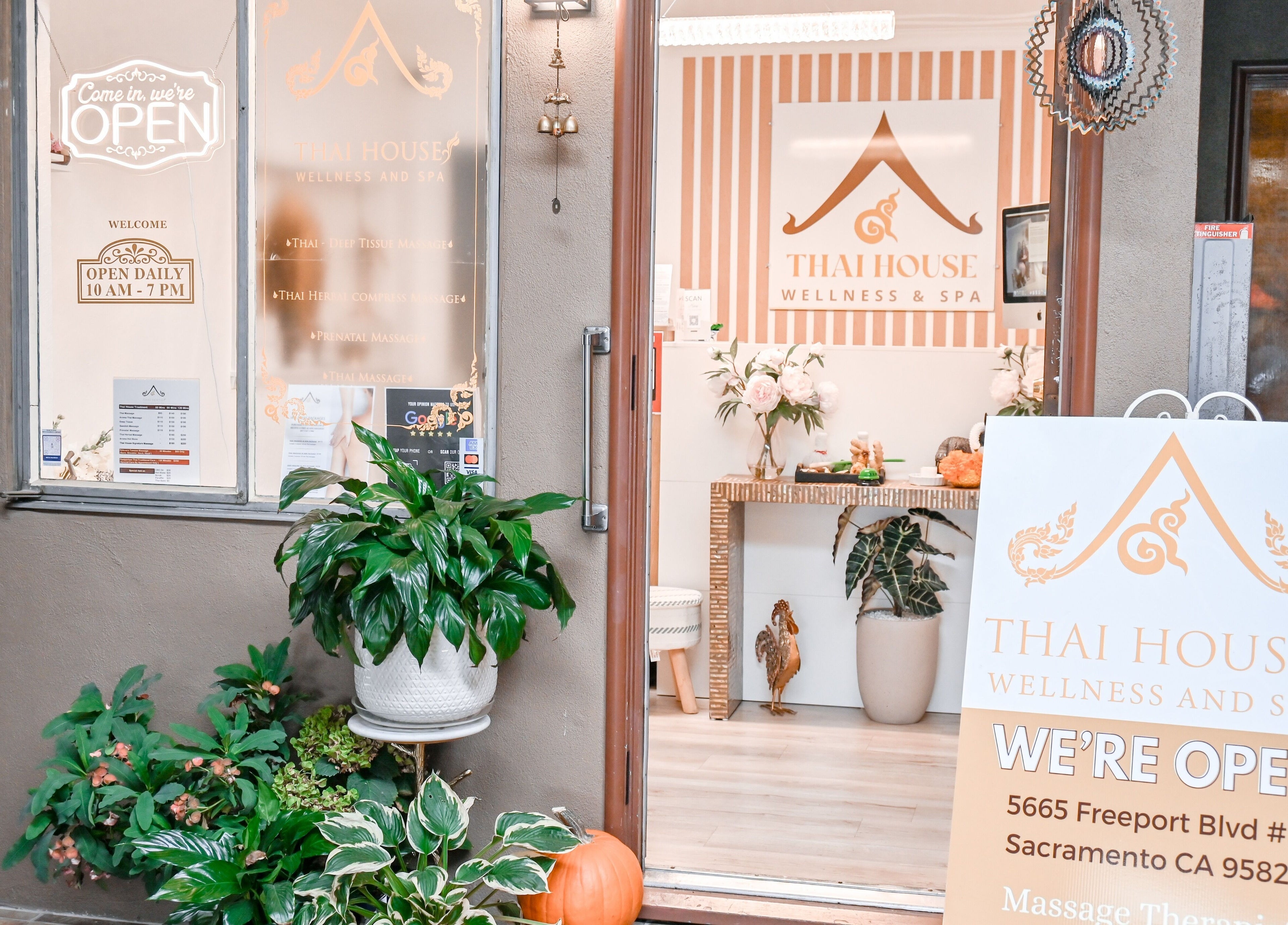 Inviting entrance of Thai House Wellness and Spa in Sacramento, California, US with welcoming signs and plants.