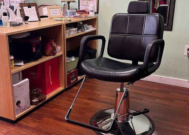Modern styling chair at Vida Beauty Brow in Altamonte Springs, Florida, US, highlighting elegance and comfort.