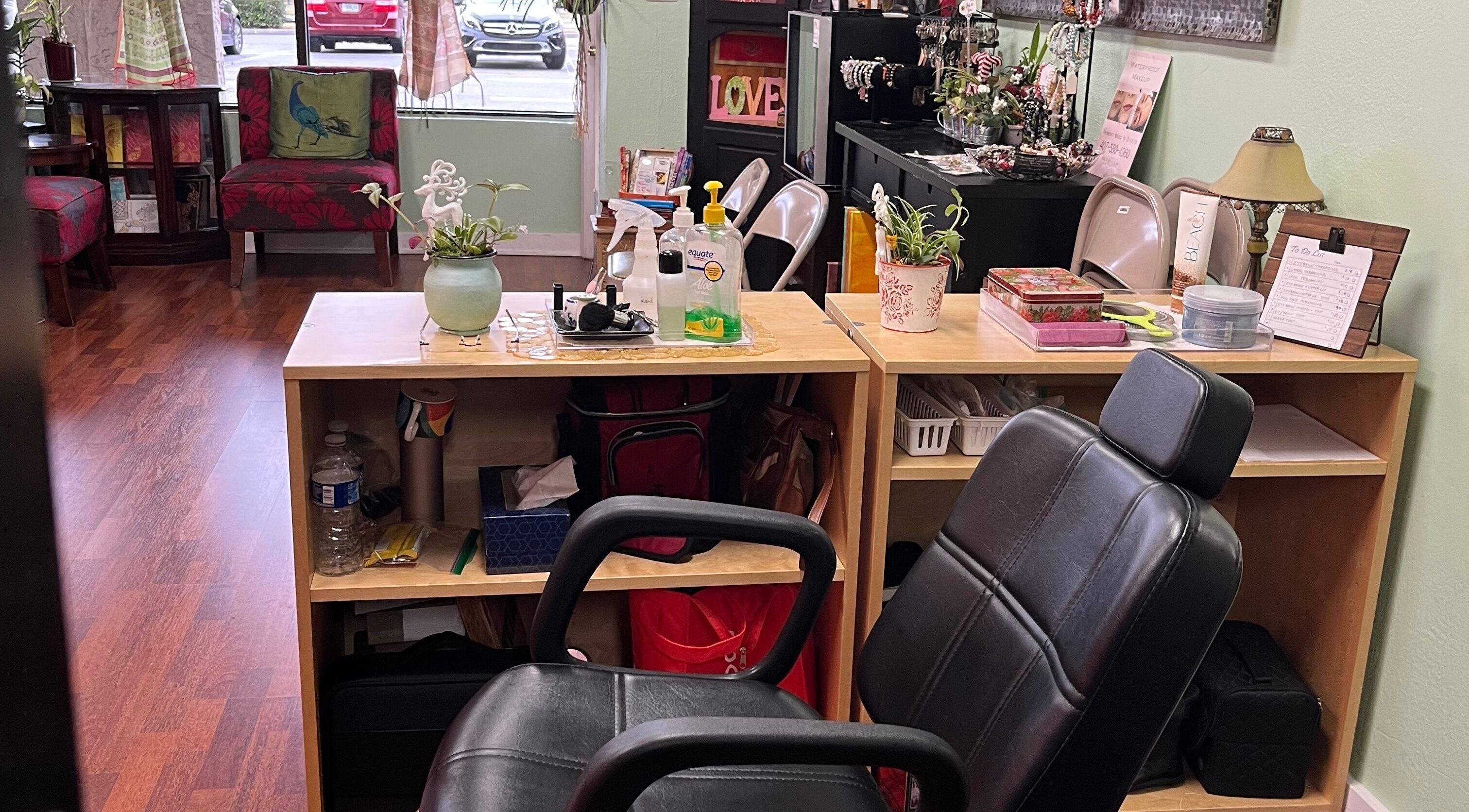 Cozy nail station at Vida Beauty Brow, Altamonte Springs, Florida, US with chairs, plants, and beauty products.