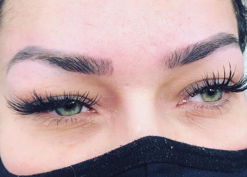 Close-up of expertly styled eyebrows at Vida Beauty Brow in Altamonte Springs, Florida, US, showcasing lush lashes.