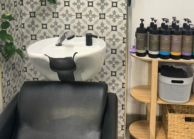 Modern shampoo wash station at Studio Hi Gorgeous, Alfredton, Victoria, AU, showcasing premium hair care products.