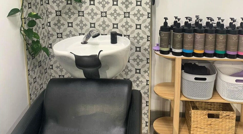 Modern shampoo wash station at Studio Hi Gorgeous, Alfredton, Victoria, AU, showcasing premium hair care products.