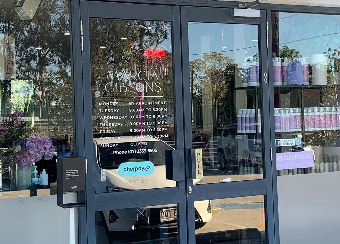 Entrance of Studio Hi Gorgeous in Alfredton, Victoria, AU featuring glass doors and wellness products.