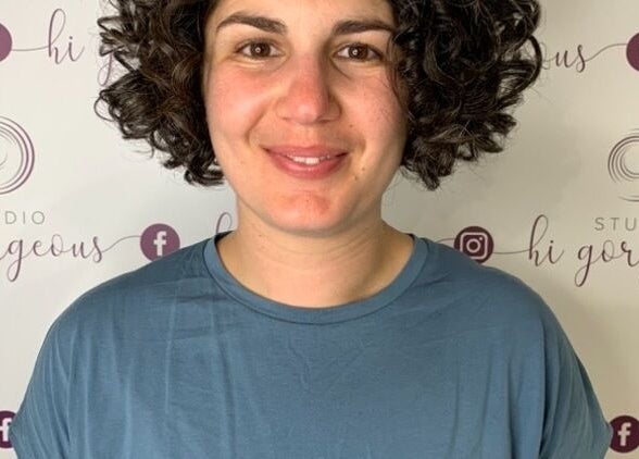 Smiling individual at Studio Hi Gorgeous backdrop in Alfredton, Victoria, AU.