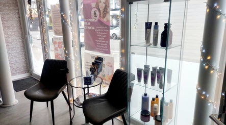 Chic seating area with products at Palmarys in Southampton, England, GB, showcasing a cozy, elegant vibe.
