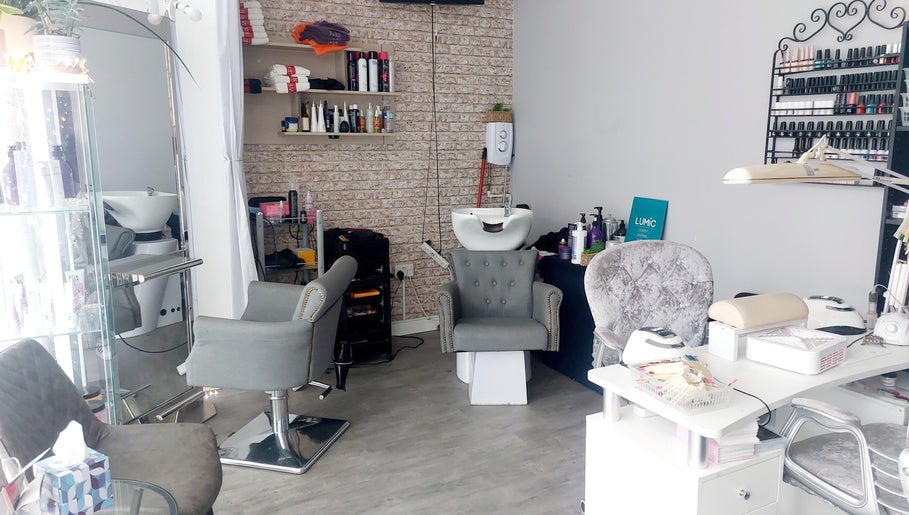 Modern beauty salon interior at Palmarys, Southampton, England, GB featuring stylish chairs and beauty station.