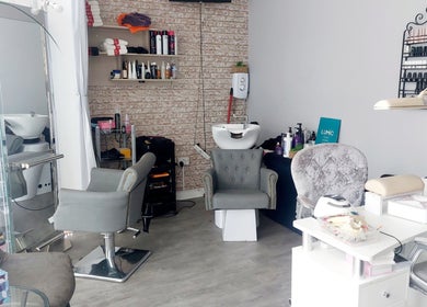 Modern beauty salon interior at Palmarys, Southampton, England, GB featuring stylish chairs and beauty station.