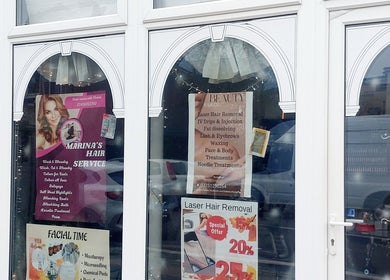 Palmarys beauty salon entrance displaying service posters in Southampton, England, GB.