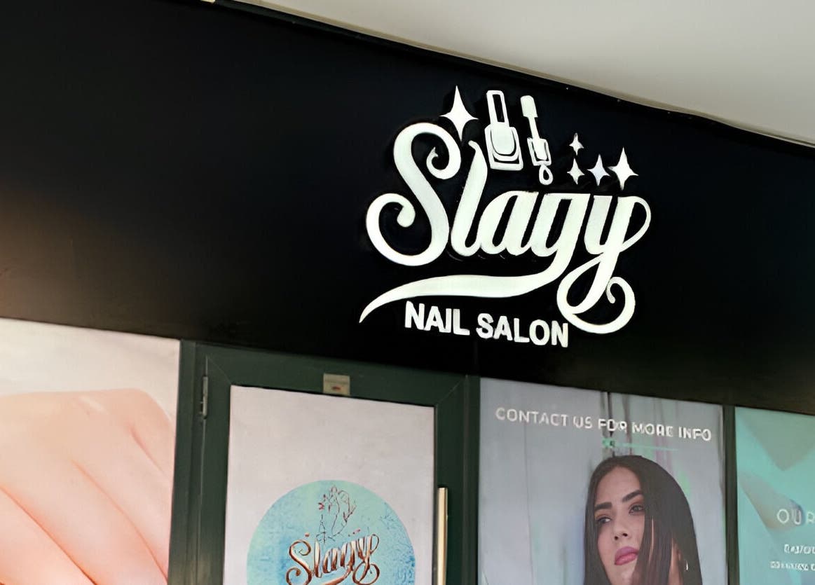 Exterior view of Slayy Nails, a stylish nail salon in Dubai, Dubai, AE, showcasing elegant signage.