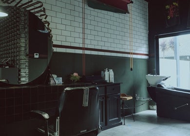 Elegant salon interior with mirror and chair at 36th Chamber, Gungahlin, Australian Capital Territory, AU.