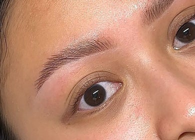 Close-up of expertly shaped eyebrows at Glos Skin & Beauty, Helensvale, Queensland, AU.